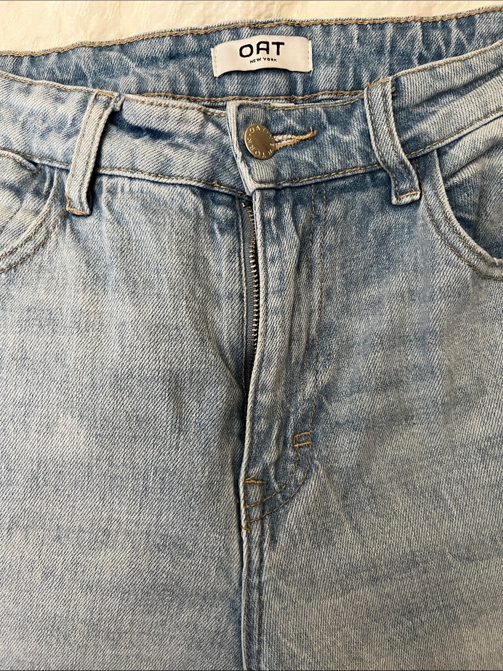 OAT New York Women’s Light Blue Distressed Denim Jeans With Rips On The Knees
